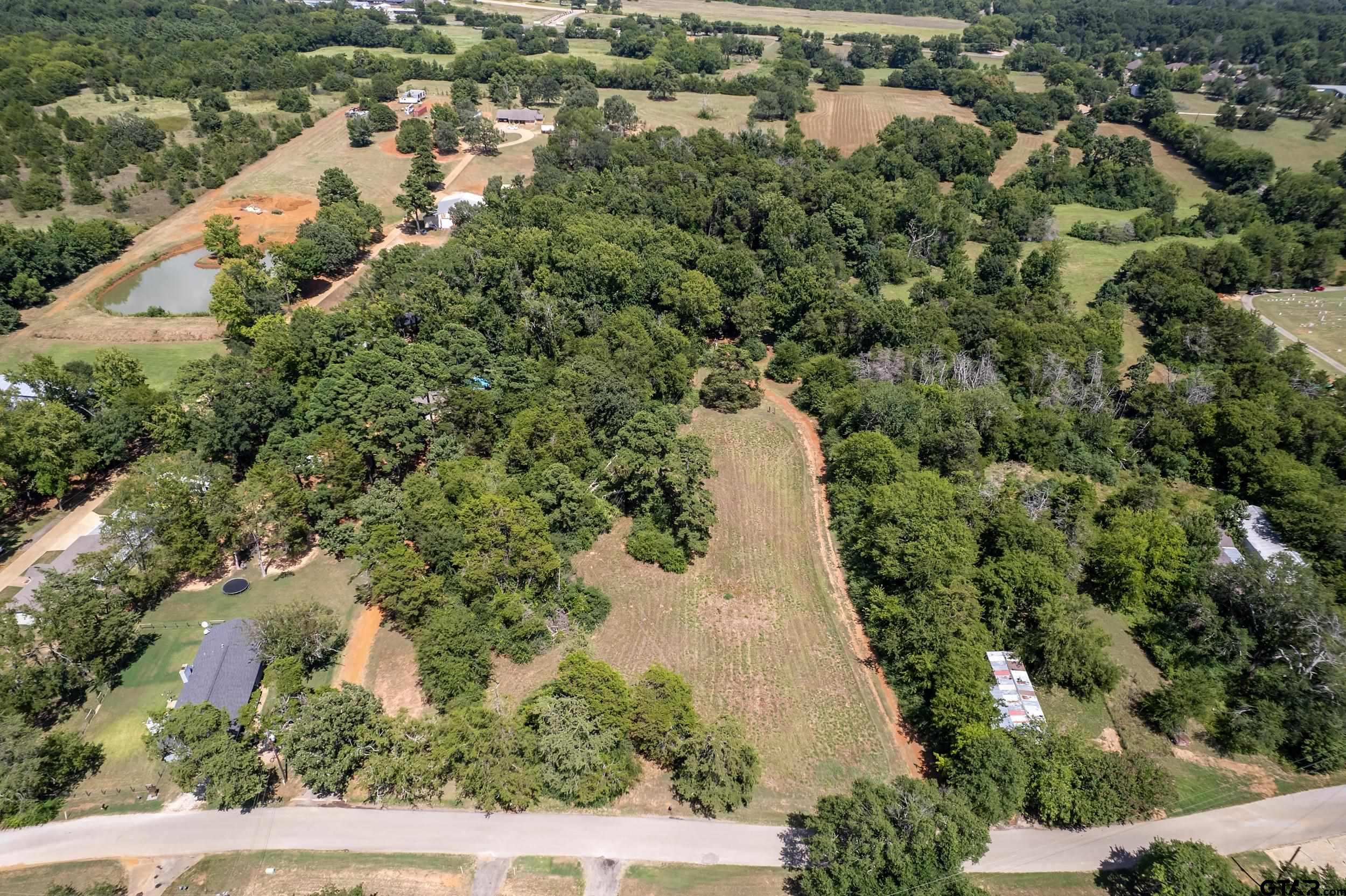 13174 County Road 434 Lindale, TX 75771 - Photo 32 of 32 an aerial view of a house with a yard and lake view