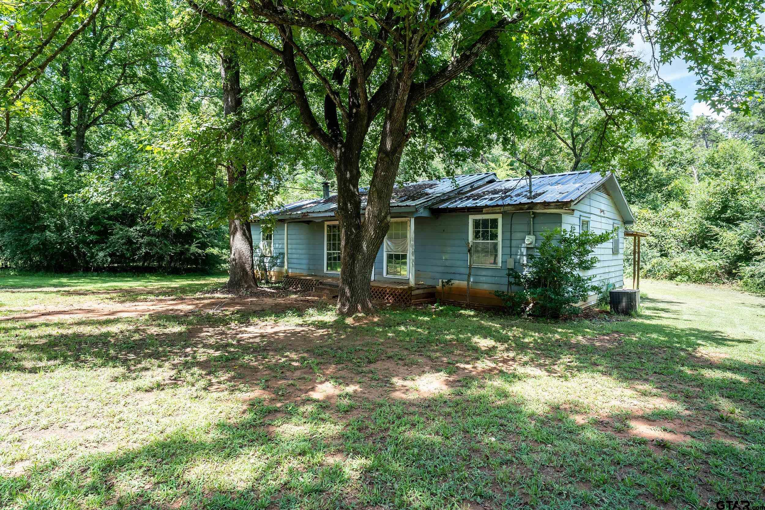 13174 County Road 434 Lindale, TX 75771 - Photo 6 of 32 a view of a house with backyard and garden