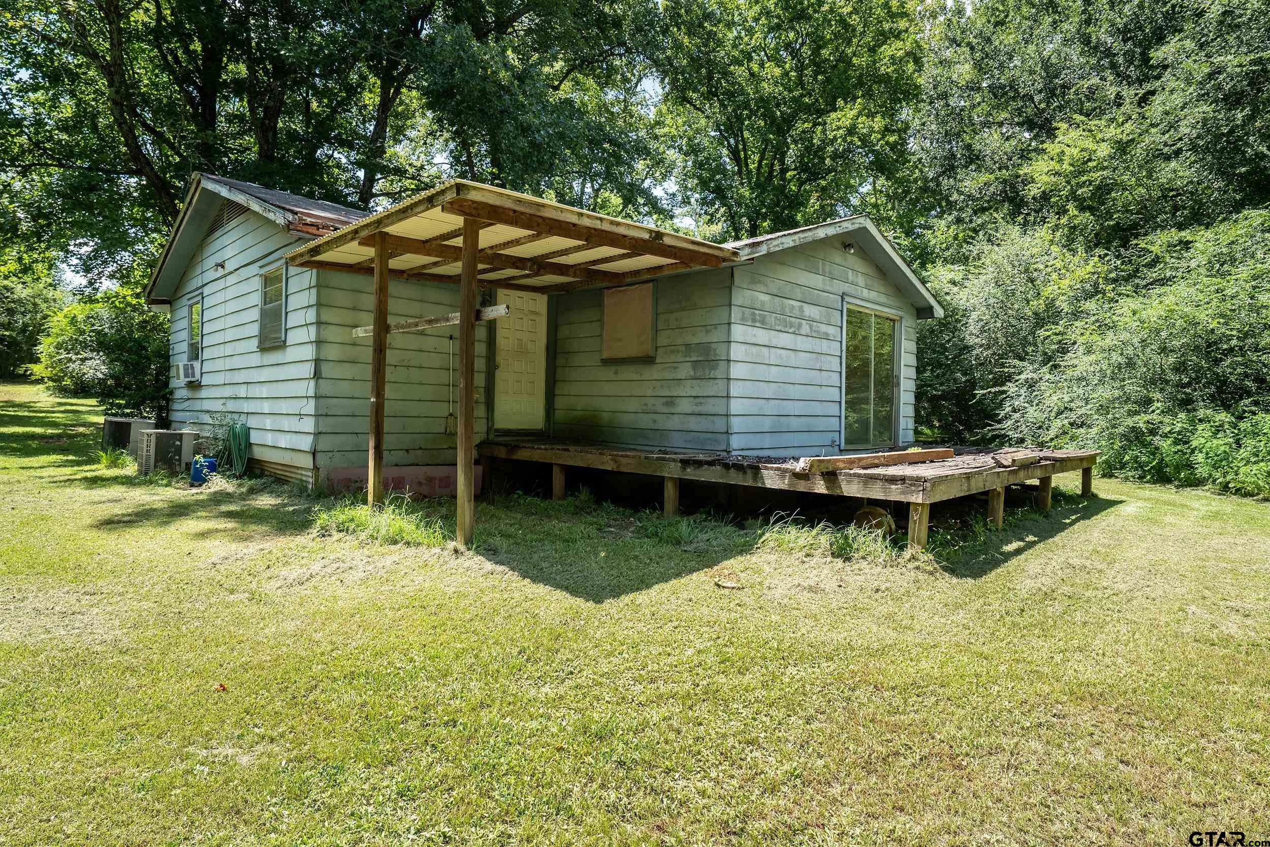 13174 County Road 434 Lindale, TX 75771 - Photo 7 of 32 a view of a house with backyard and sitting area