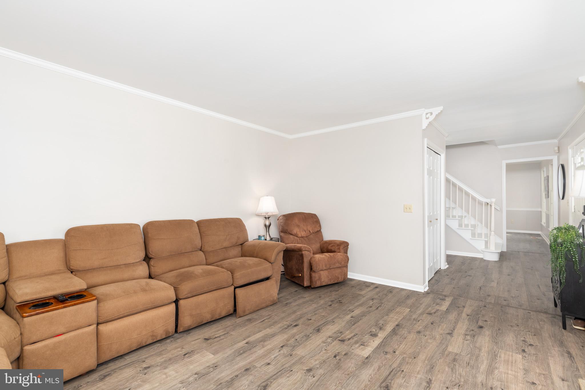 35588 Lizzard Hill Road Frankford, DE 19945 - Photo 16 of 39 a living room with furniture and a wooden floor