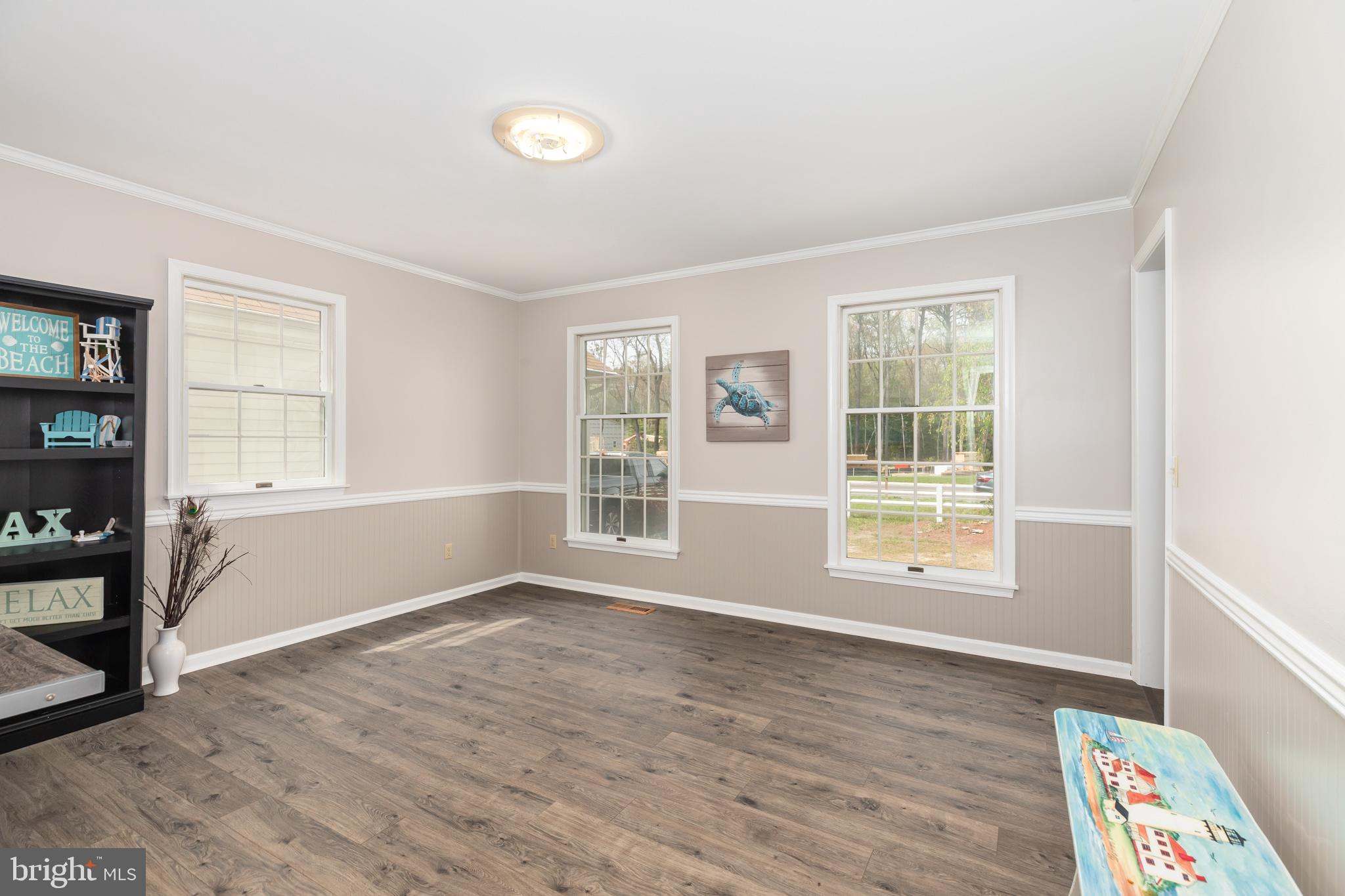 35588 Lizzard Hill Road Frankford, DE 19945 - Photo 18 of 39 an empty room with wooden floor and windows