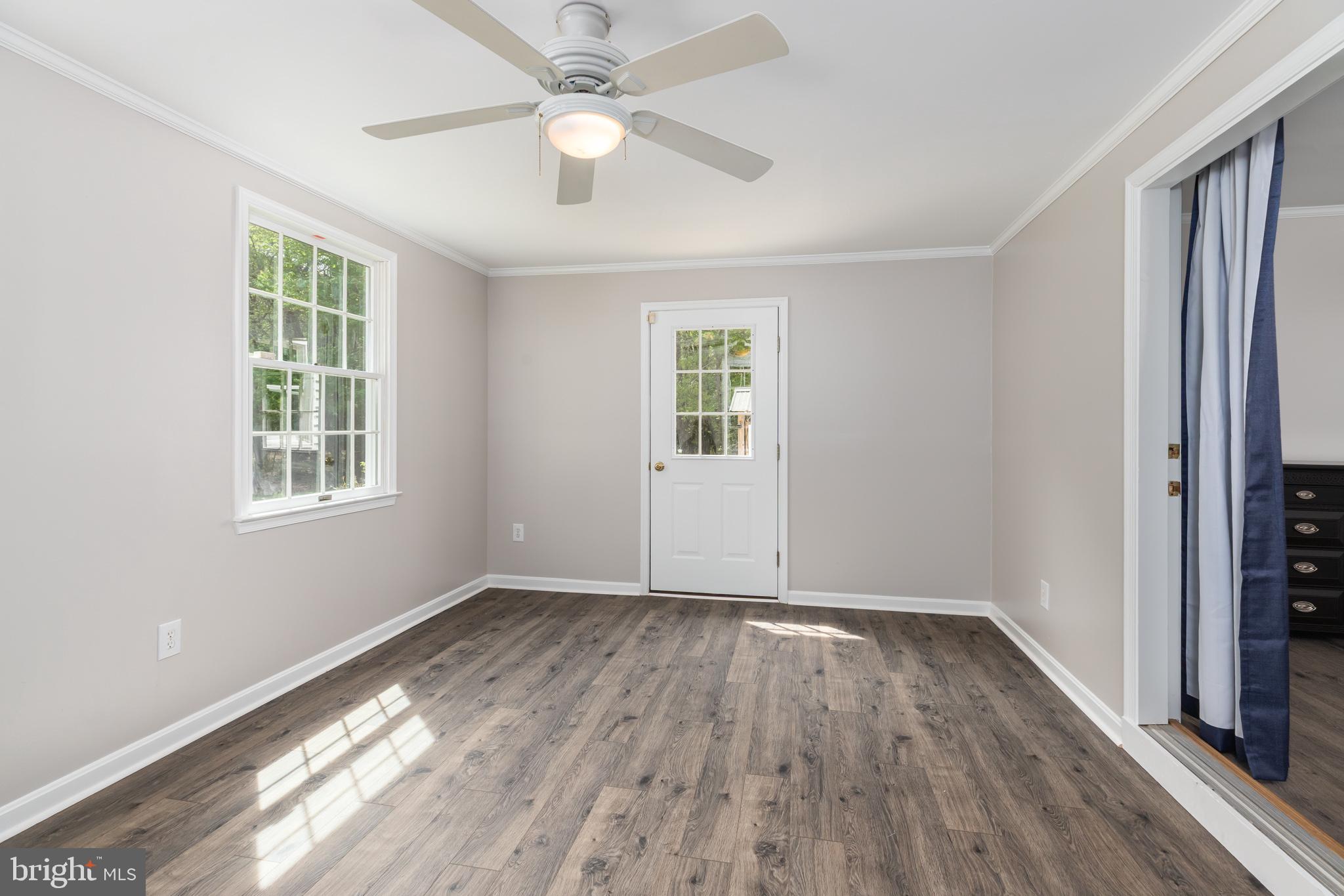35588 Lizzard Hill Road Frankford, DE 19945 - Photo 22 of 39 wooden floor in an empty room with a window
