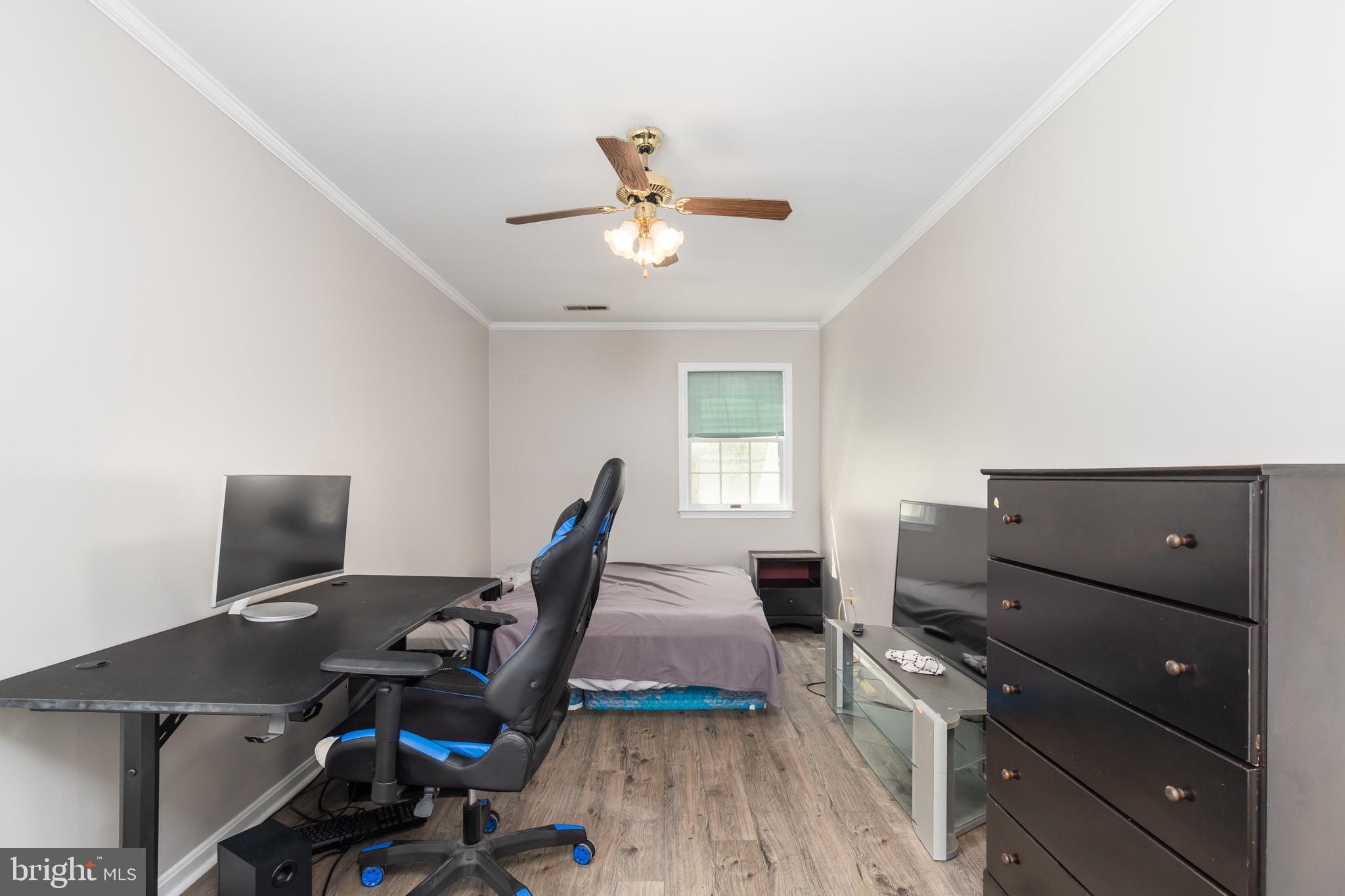 35588 Lizzard Hill Road Frankford, DE 19945 - Photo 27 of 39 a workspace with furniture and wooden floor
