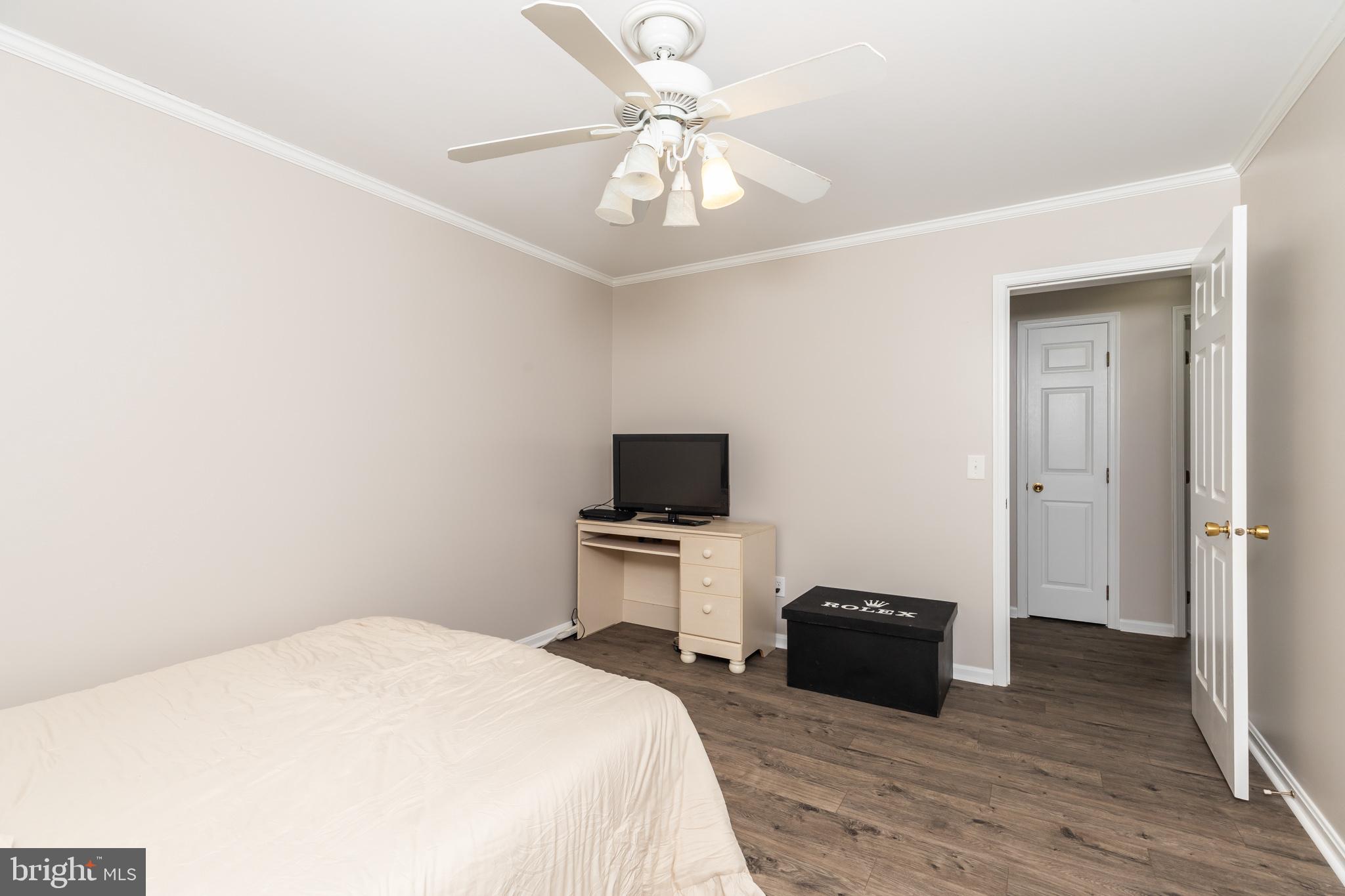 35588 Lizzard Hill Road Frankford, DE 19945 - Photo 30 of 39 a bedroom with a bed and a television