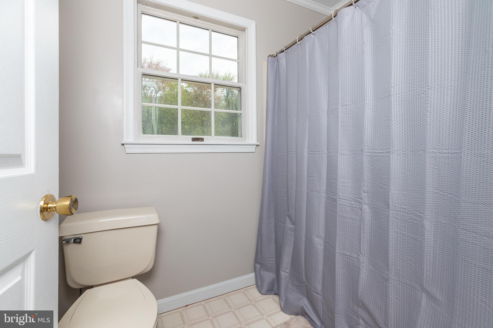 35588 Lizzard Hill Road Frankford, DE 19945 - Photo 34 of 39 a white toilet sitting next to a window