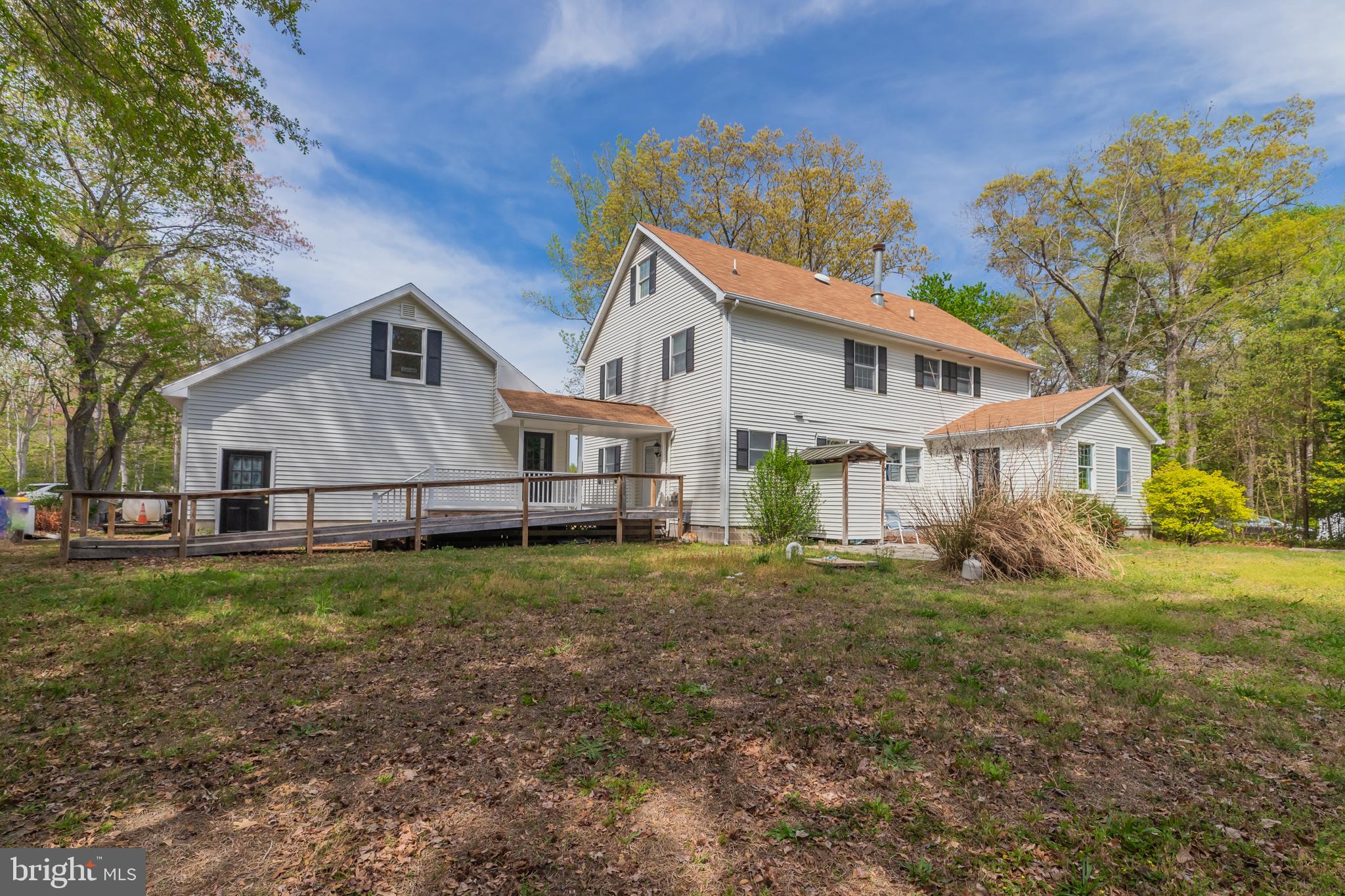 35588 Lizzard Hill Road Frankford, DE 19945 - Photo 8 of 39 a view of a yard in front of a house with large trees