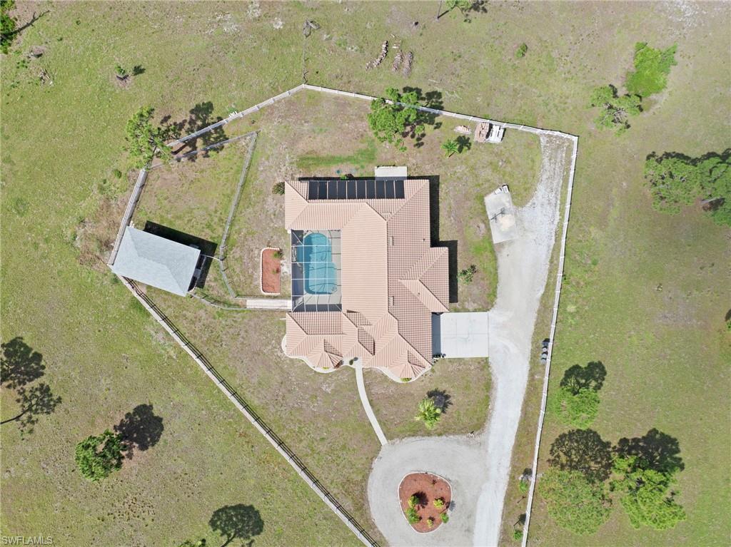 13541 Stringfellow Road Bokeelia, FL 33922 - Photo 49 of 49 an aerial view of a house with a table and a potted plant