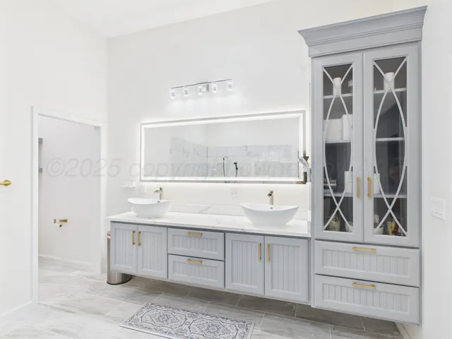 a view of cabinets a sink and a window