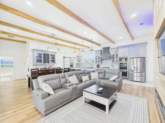 a living room with furniture and a rug