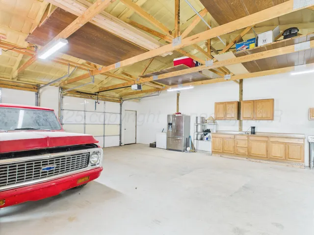 a large kitchen with a large window
