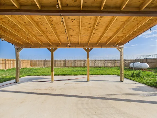 a large house with a garden and deck