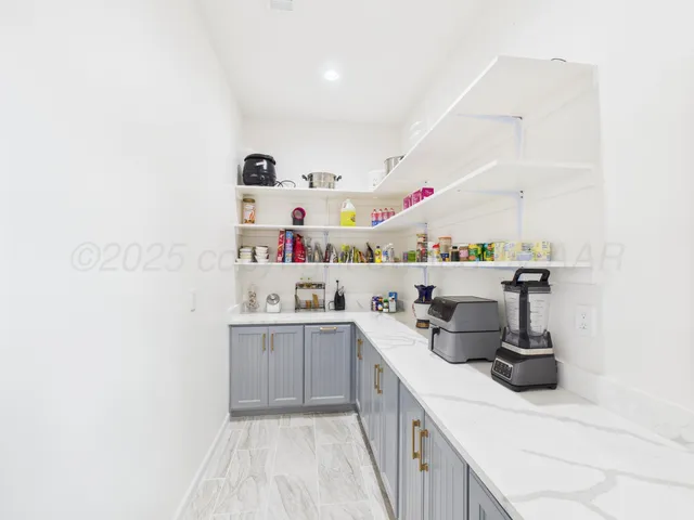 a kitchen with a sink a stove and cabinets