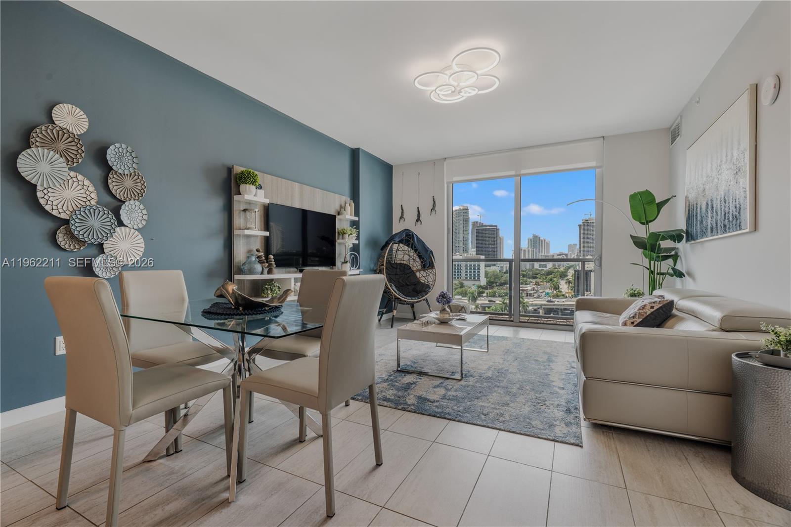 3900 Biscayne Boulevard, Unit S904 Miami, FL 33137 - Photo 37 of 43 a living room with fireplace furniture and a potted plant