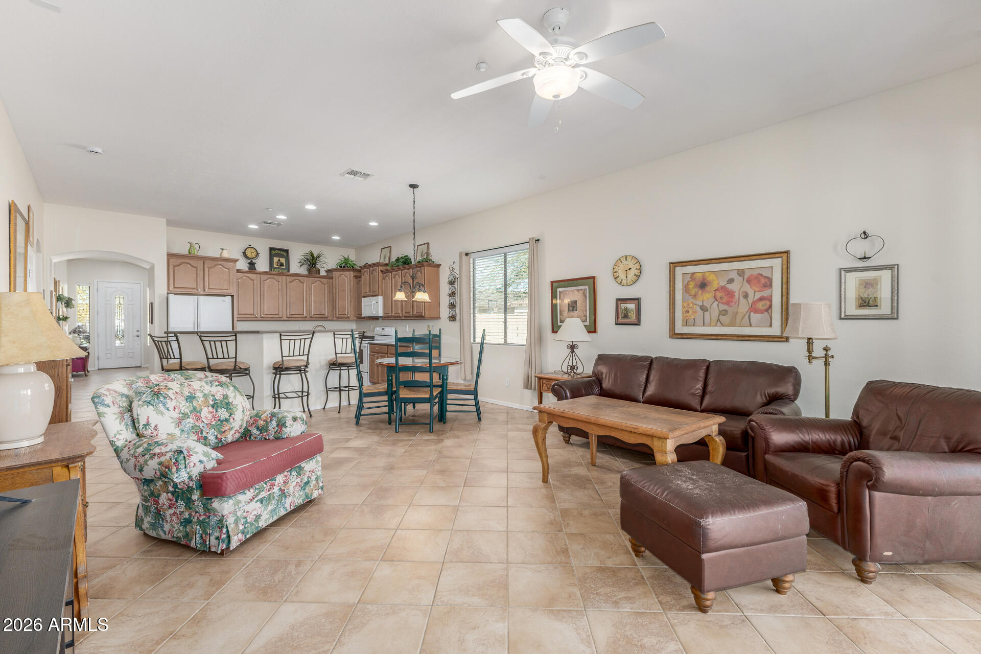 12731 West Eagle Ridge Lane Peoria, AZ 85383 - Photo 11 of 88 a living room with furniture and kitchen view