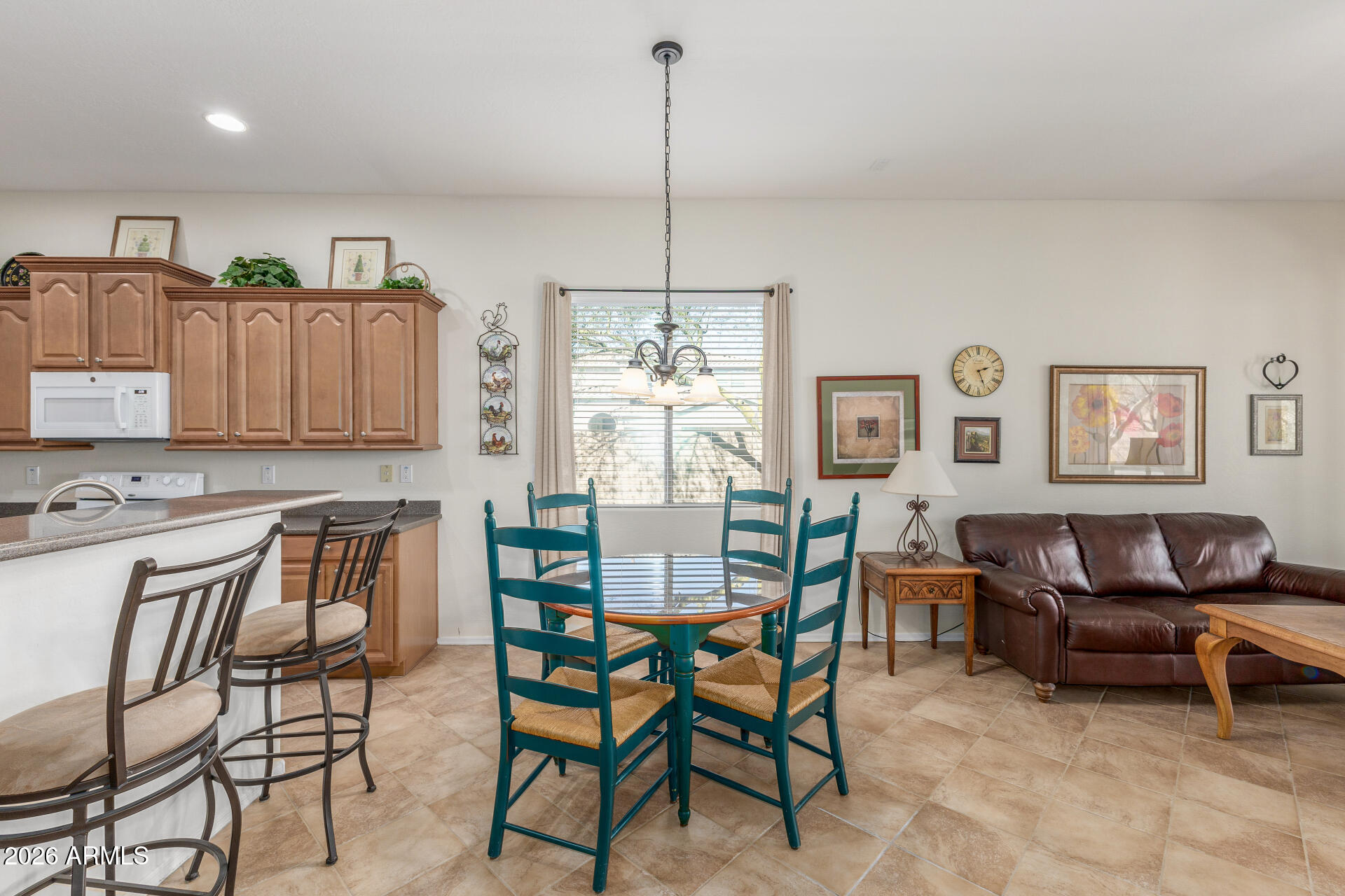 12731 West Eagle Ridge Lane Peoria, AZ 85383 - Photo 12 of 88 a dining room filled chandelier and kitchen view