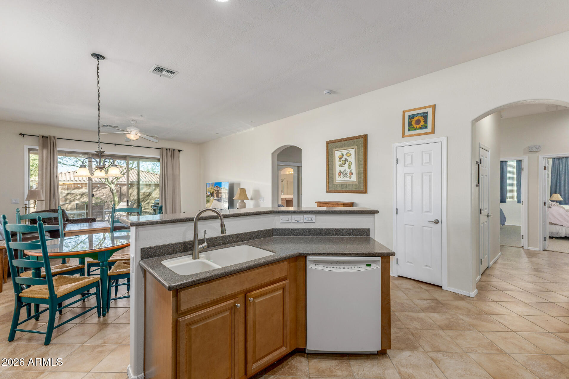 12731 West Eagle Ridge Lane Peoria, AZ 85383 - Photo 13 of 88 a kitchen with sink cabinets and dining table