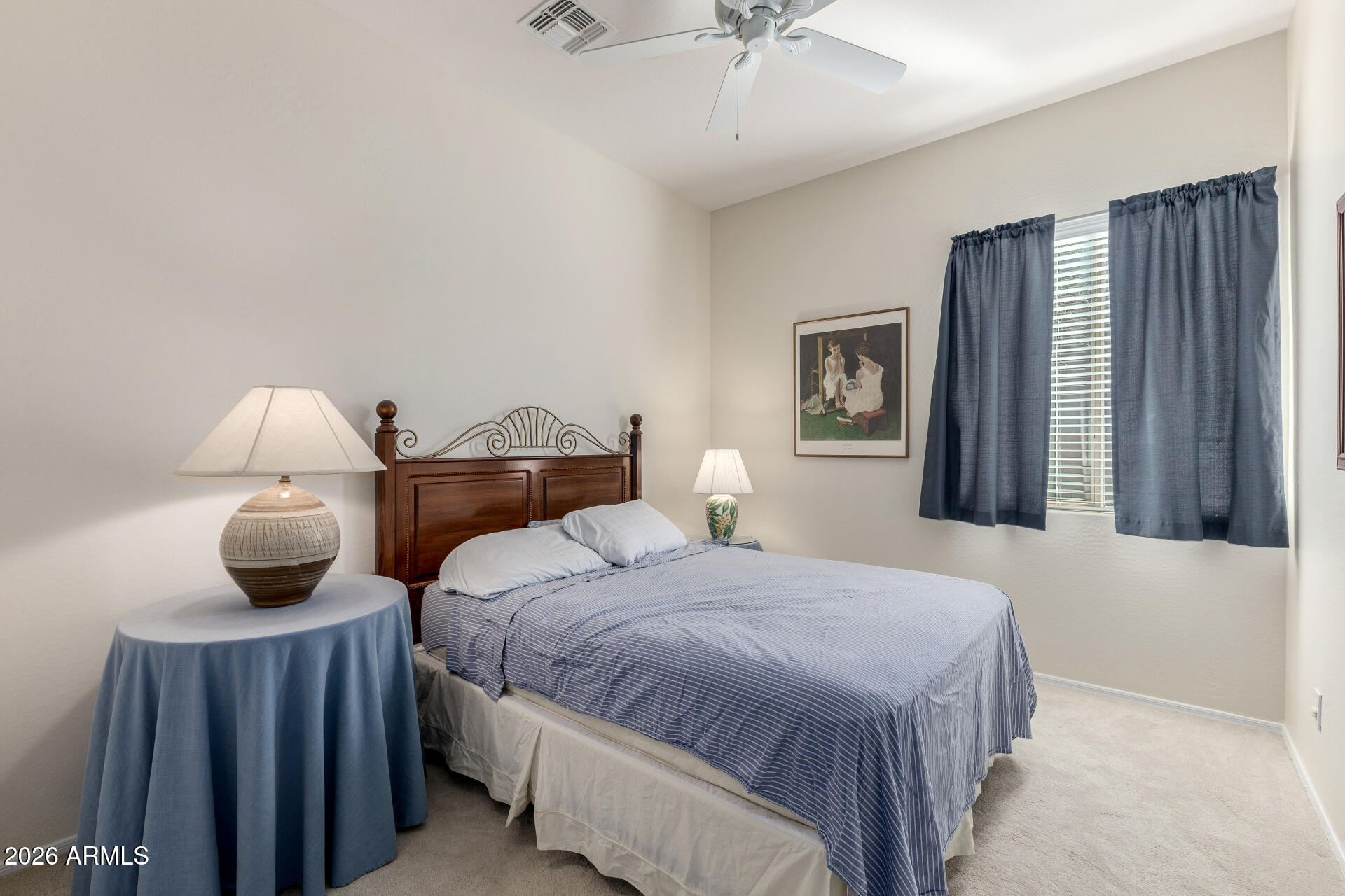 12731 West Eagle Ridge Lane Peoria, AZ 85383 - Photo 19 of 88 a bedroom with a bed and a chandelier
