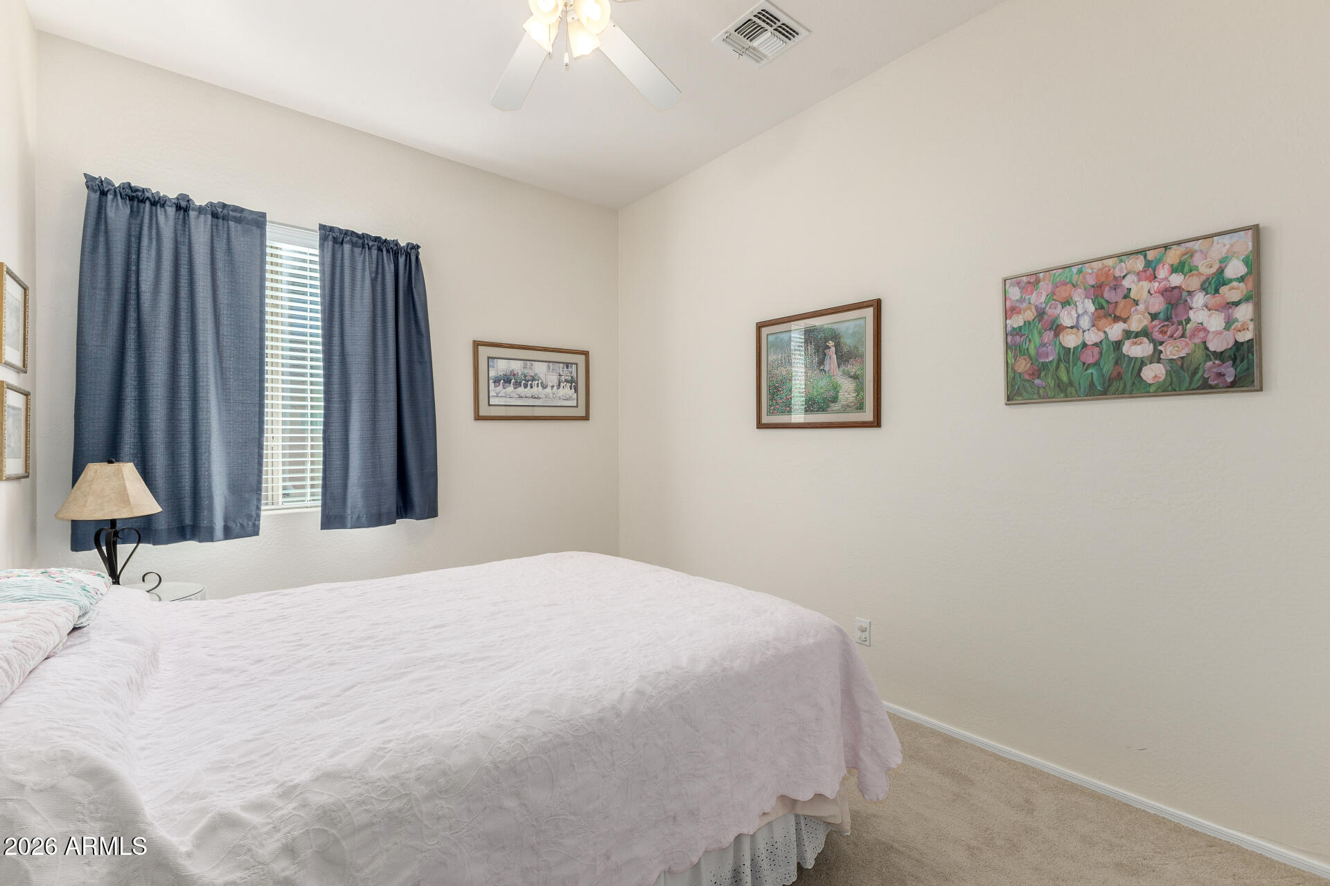 12731 West Eagle Ridge Lane Peoria, AZ 85383 - Photo 21 of 88 a bedroom with a bed and a painting on the wall