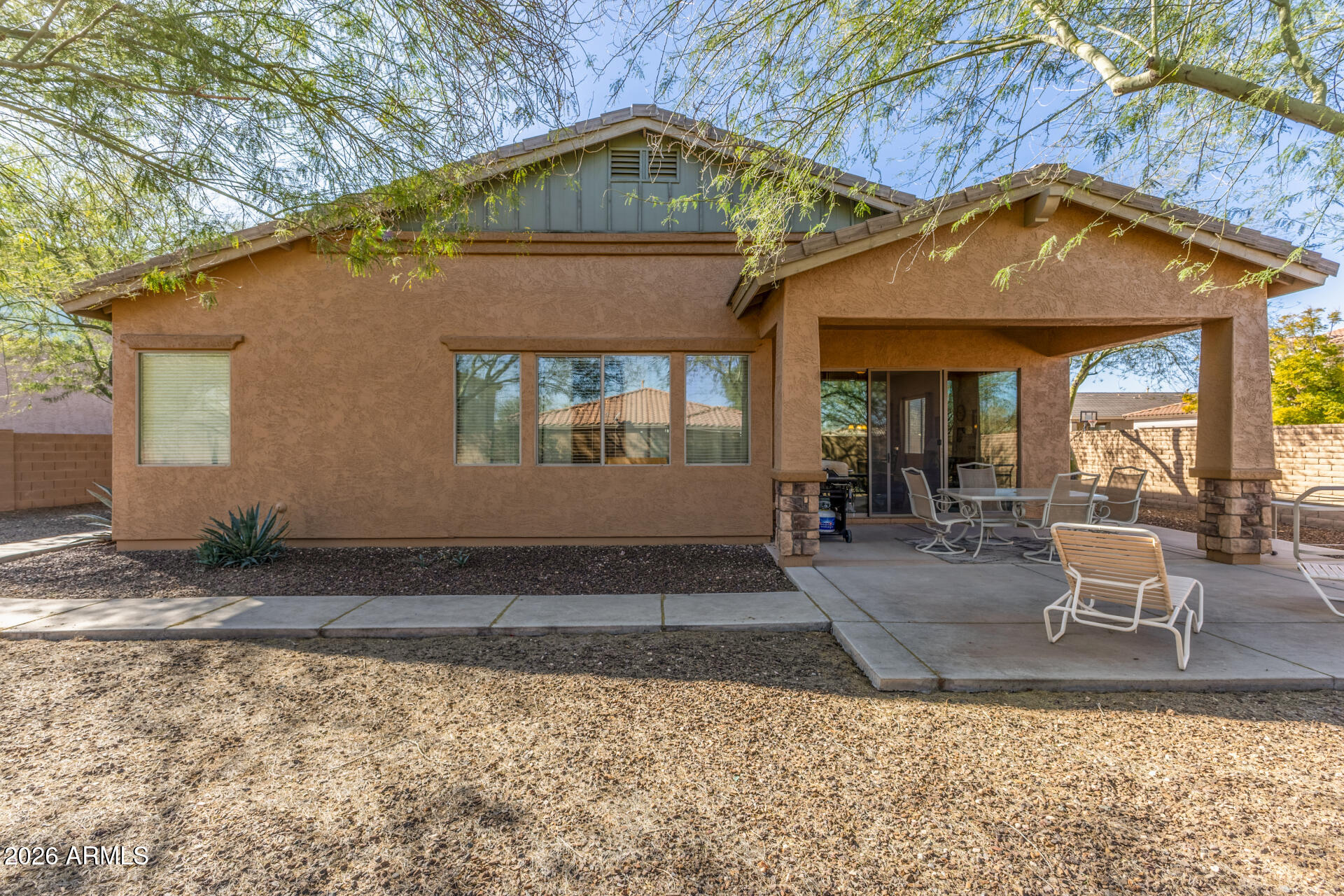 12731 West Eagle Ridge Lane Peoria, AZ 85383 - Photo 6 of 88 a front view of a house with a yard