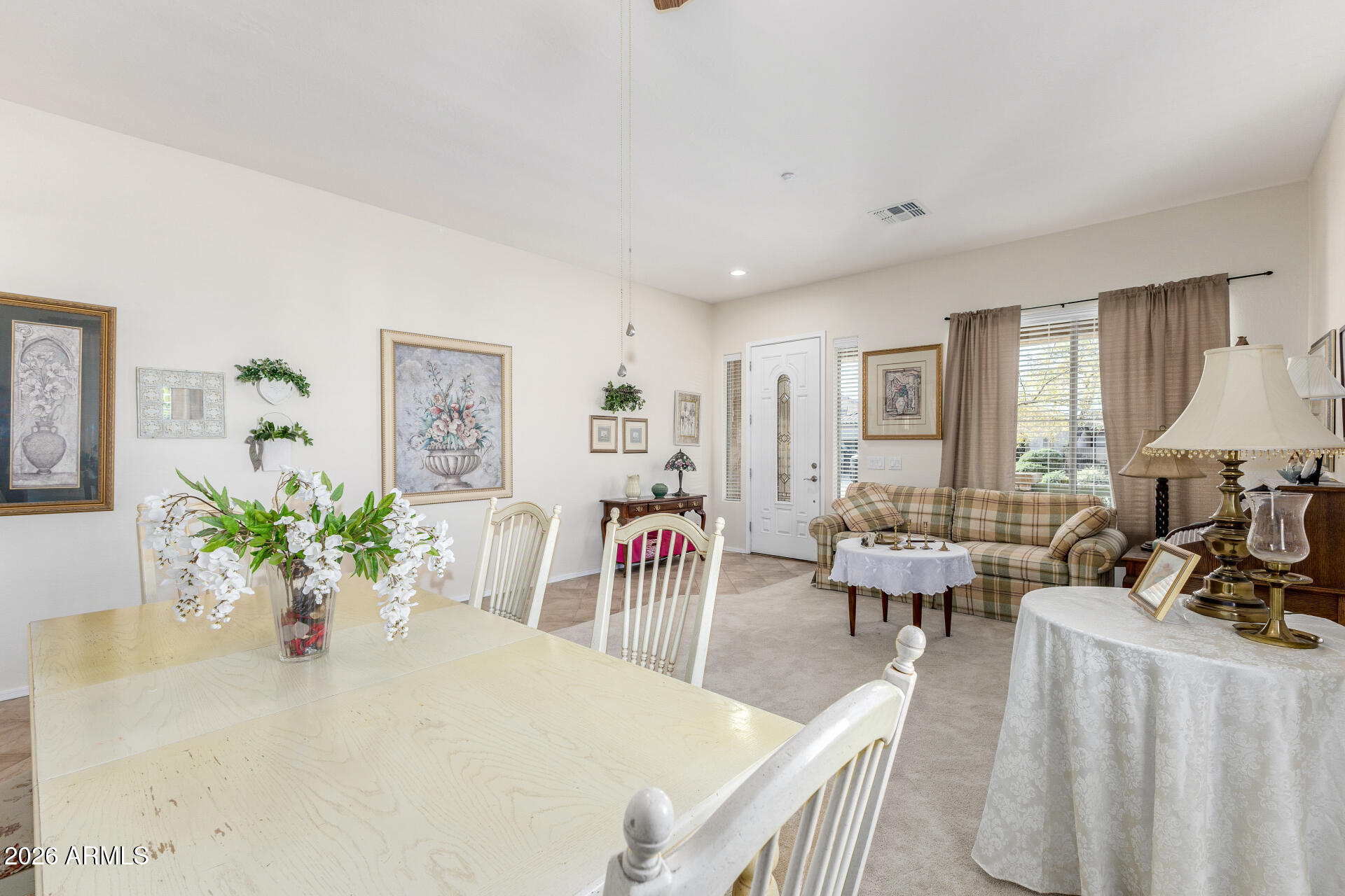 12731 West Eagle Ridge Lane Peoria, AZ 85383 - Photo 9 of 88 a view of a dining room with furniture and a chandelier