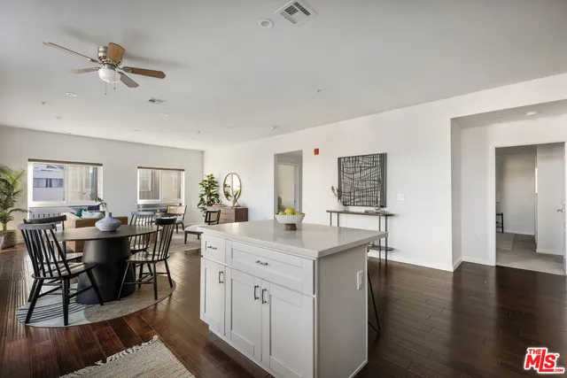 a kitchen with cabinets stainless steel appliances a sink and a microwave