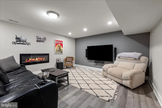 a view of a house with swimming pool and sitting area