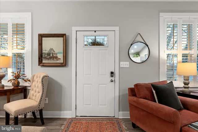a kitchen with a refrigerator and a stove top oven