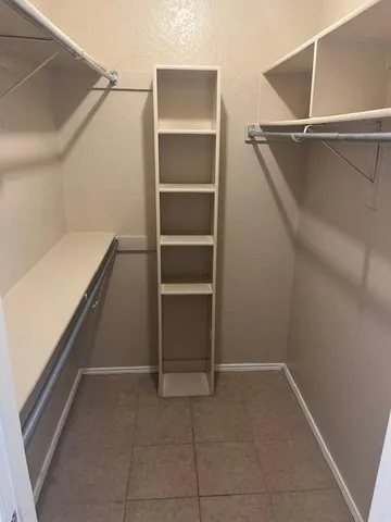 a view of an empty walk in closet