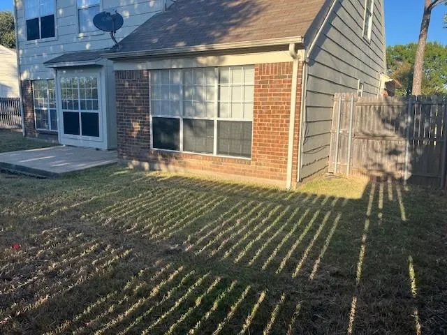 a view of a backyard with sitting area