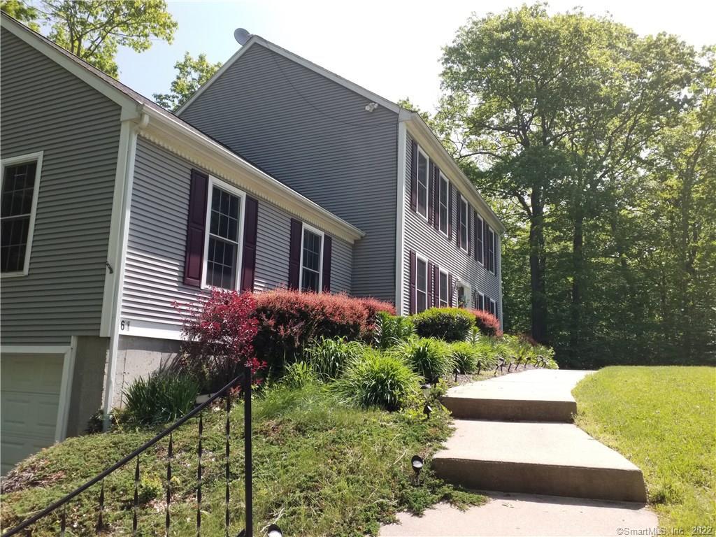 61 Old Colchester Rd Extension Montville, CT 06370 - Photo 1 of 1 a front view of a house with a yard