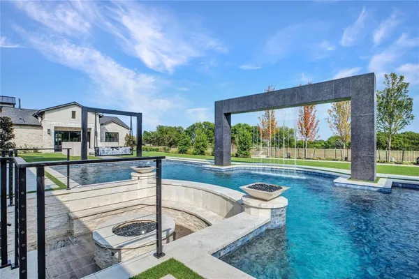 a view of swimming pool with outdoor seating