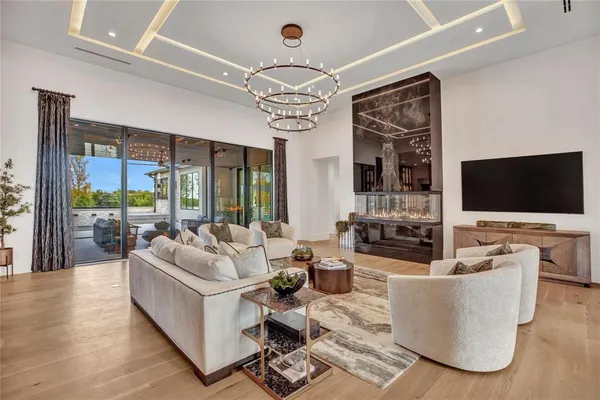 a living room with fireplace furniture and a flat screen tv