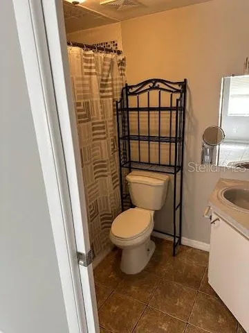 a bathroom with a toilet and a sink
