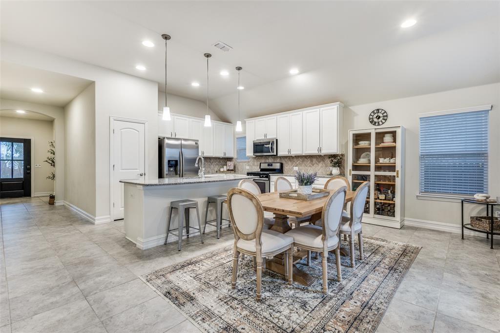 413 Yellowstone Drive Celina, TX 75009 - Photo 13 of 33 a view of a dining room with furniture
