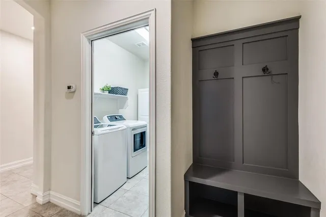 a view of bathroom with a sink and mirror