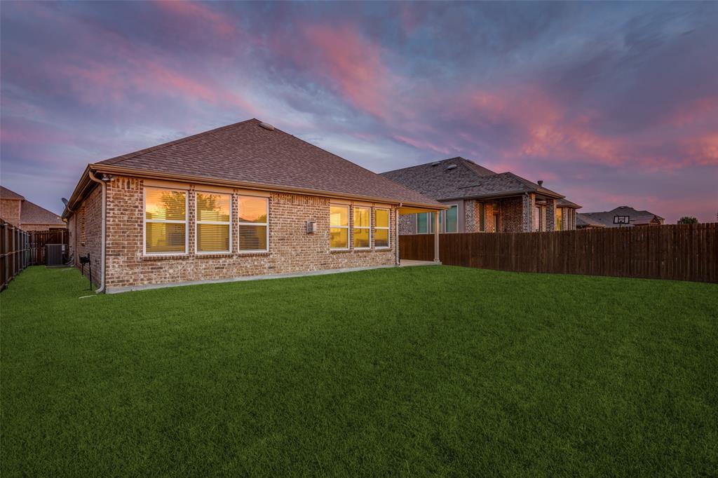 413 Yellowstone Drive Celina, TX 75009 - Photo 24 of 33 a view of a house with a backyard