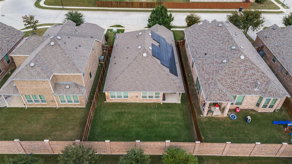 413 Yellowstone Drive Celina, TX 75009 - Photo 26 of 33 an aerial view of a house with a yard