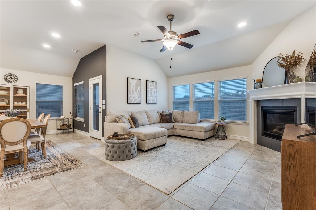 413 Yellowstone Drive Celina, TX 75009 - Photo 4 of 33 a living room with furniture and a fireplace