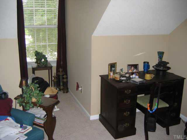 134 Wythe Circle Raleigh, NC 27615 - Photo 9 of 10 a living room with furniture and a potted plant