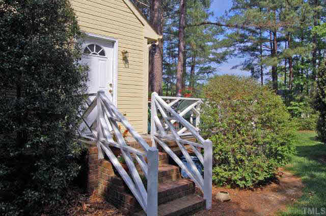 134 Wythe Circle Raleigh, NC 27615 - Photo 10 of 10 a front view of a house with lots of trees