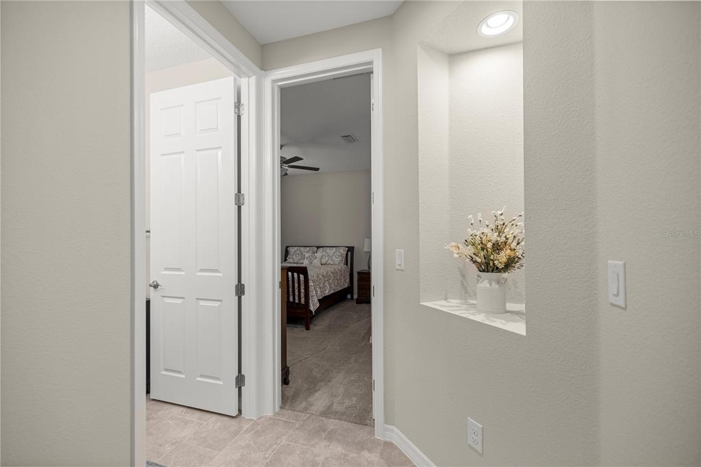 5504 Northwest 40th Loop Ocala, FL 34482 - Photo 19 of 31 a view of a hallway to a livingroom and a rooms