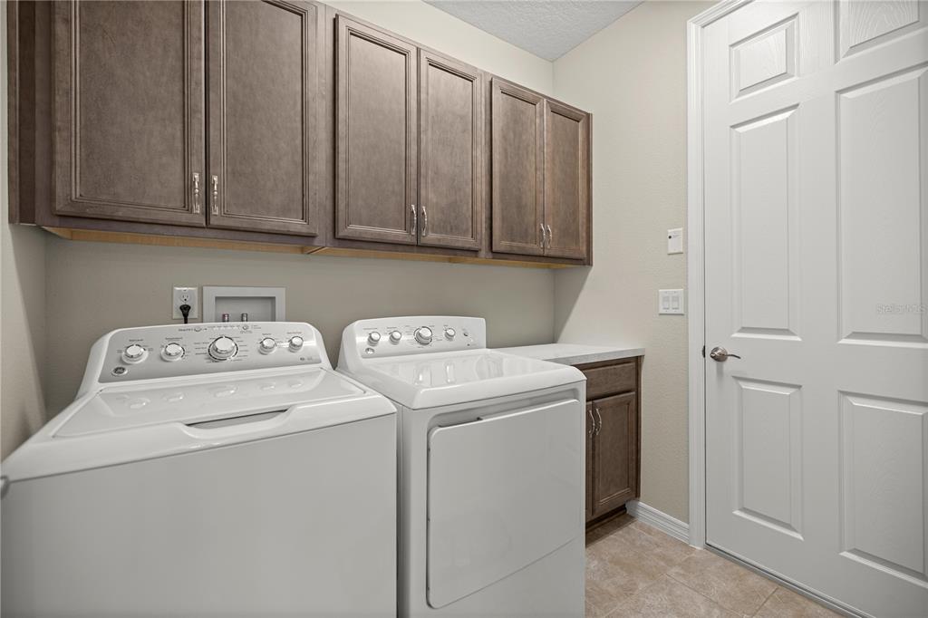 5504 Northwest 40th Loop Ocala, FL 34482 - Photo 22 of 31 a utility room with dryer and washer