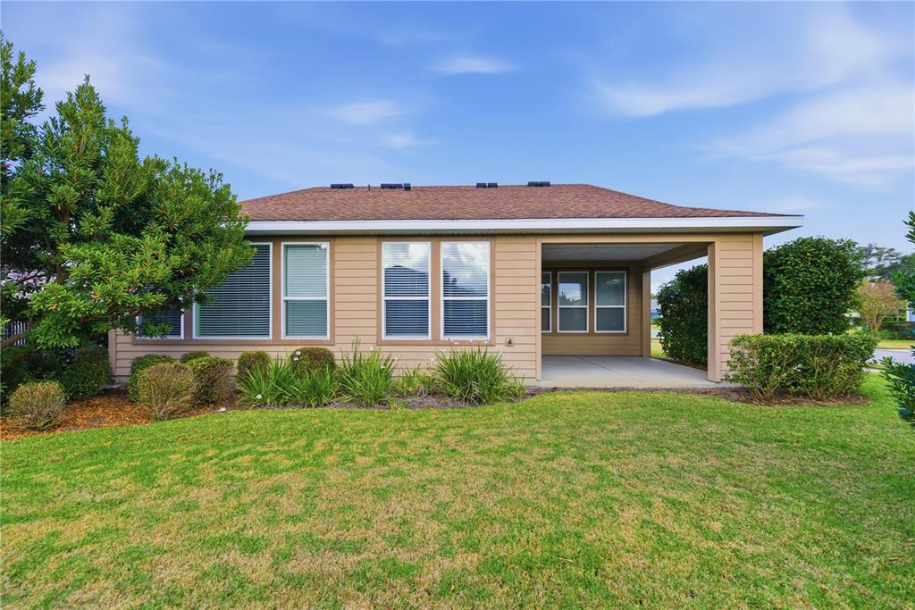 5504 Northwest 40th Loop Ocala, FL 34482 - Photo 29 of 31 a front view of a house with garden