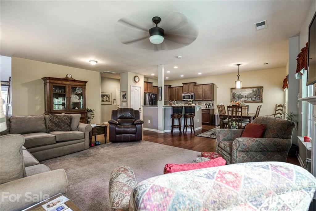 78166 Rillstone Drive Lancaster, SC 29720 - Photo 3 of 25 a bed room with furniture or kitchen view and a chandelier