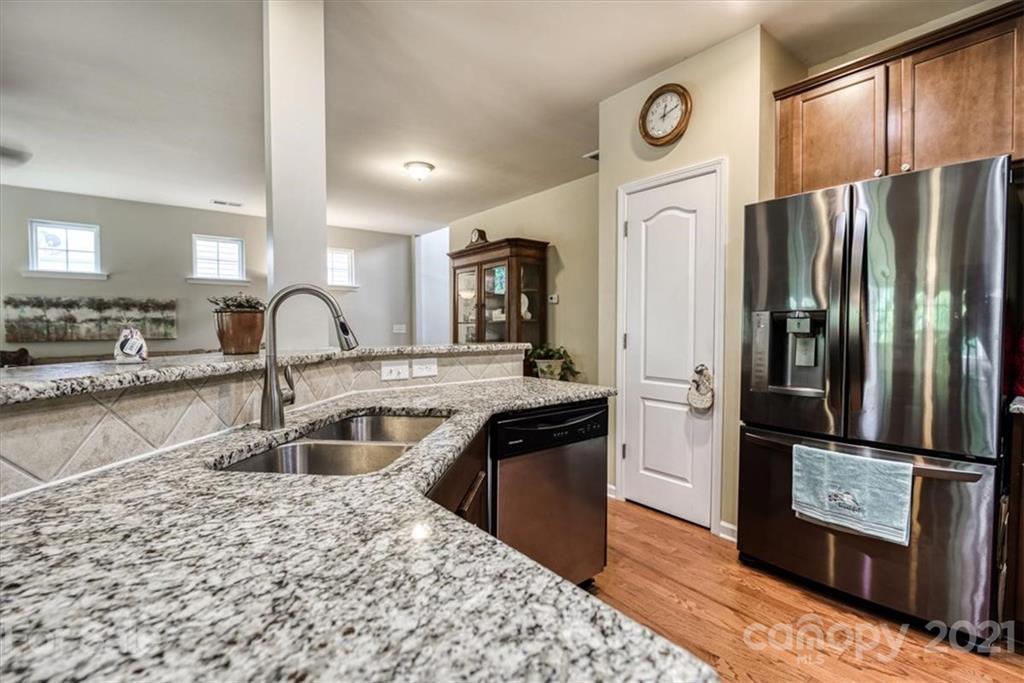 78166 Rillstone Drive Lancaster, SC 29720 - Photo 5 of 25 a kitchen with stainless steel appliances granite countertop a refrigerator and a sink