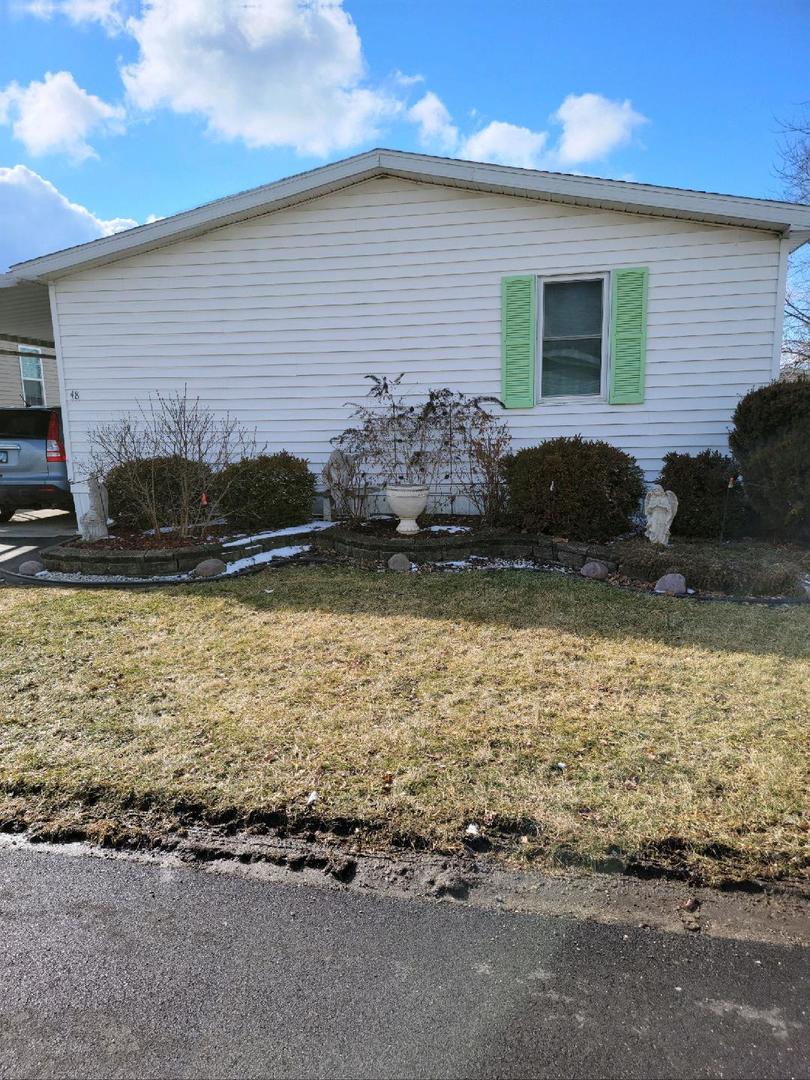 48 Cherry Lane Bourbonnais, IL 60914 - Photo 2 of 5 a view of a house with a yard