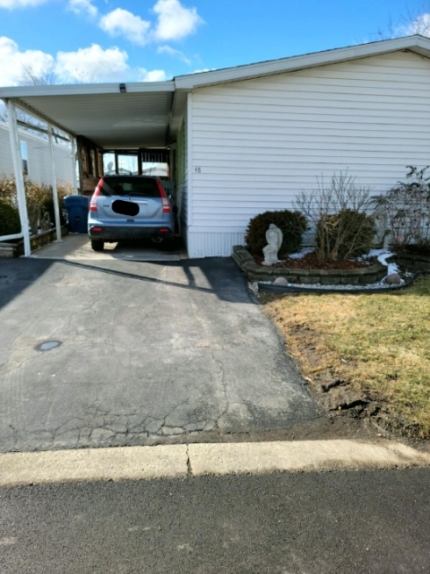 48 Cherry Lane Bourbonnais, IL 60914 - Photo 5 of 5 a car parked in front of a building