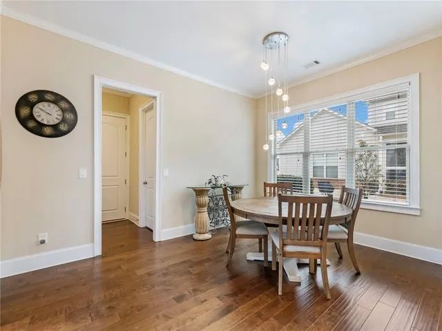 a spacious bathroom with a double vanity sink a mirror and a bathtub