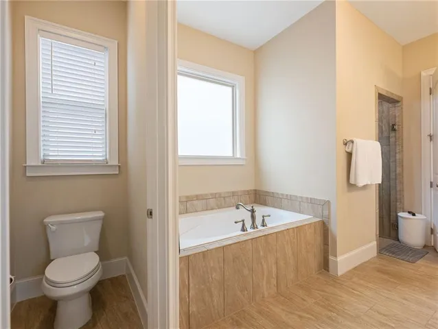 front view of a brick house with a large window