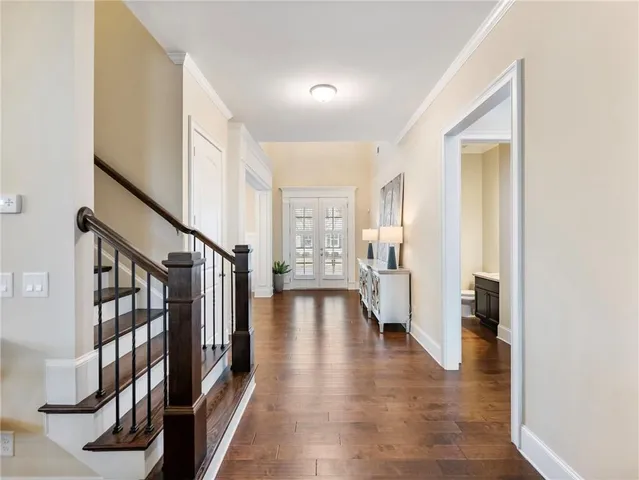 a view of living room filled with furniture and a chandelier